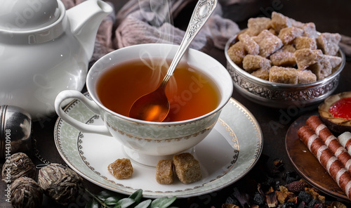 Tea hot drink on old background in composition on the table