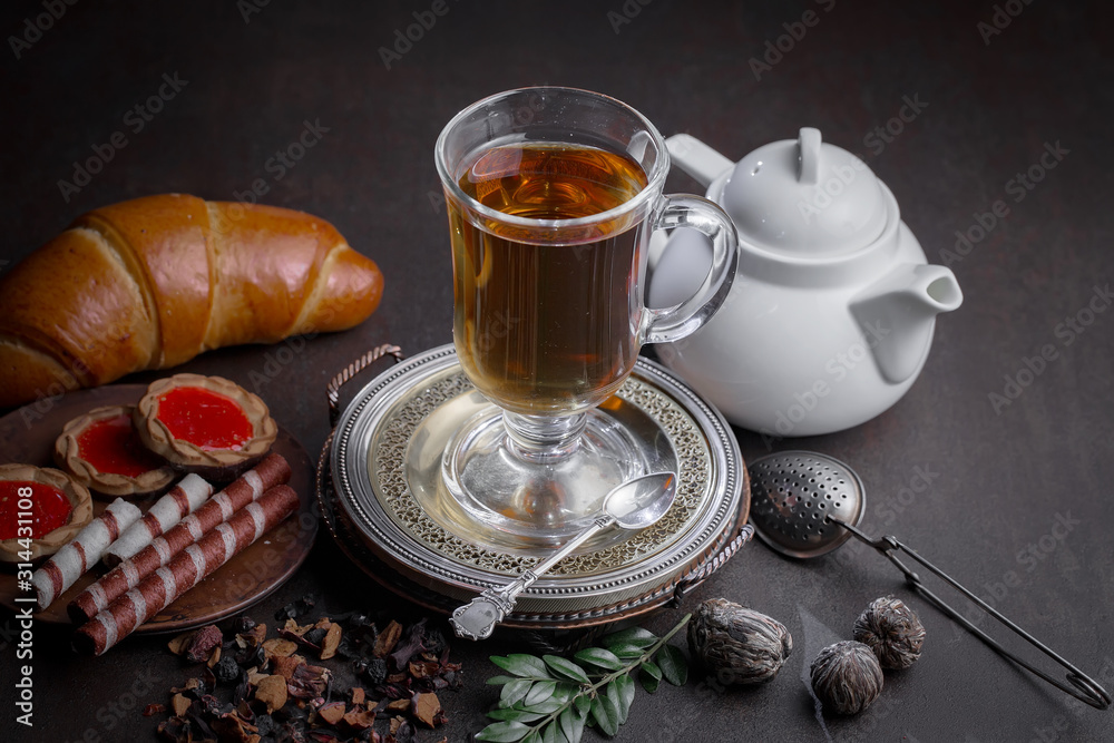 Tea hot drink on old background in composition on the table Tea hot drink on old background in composition on the table