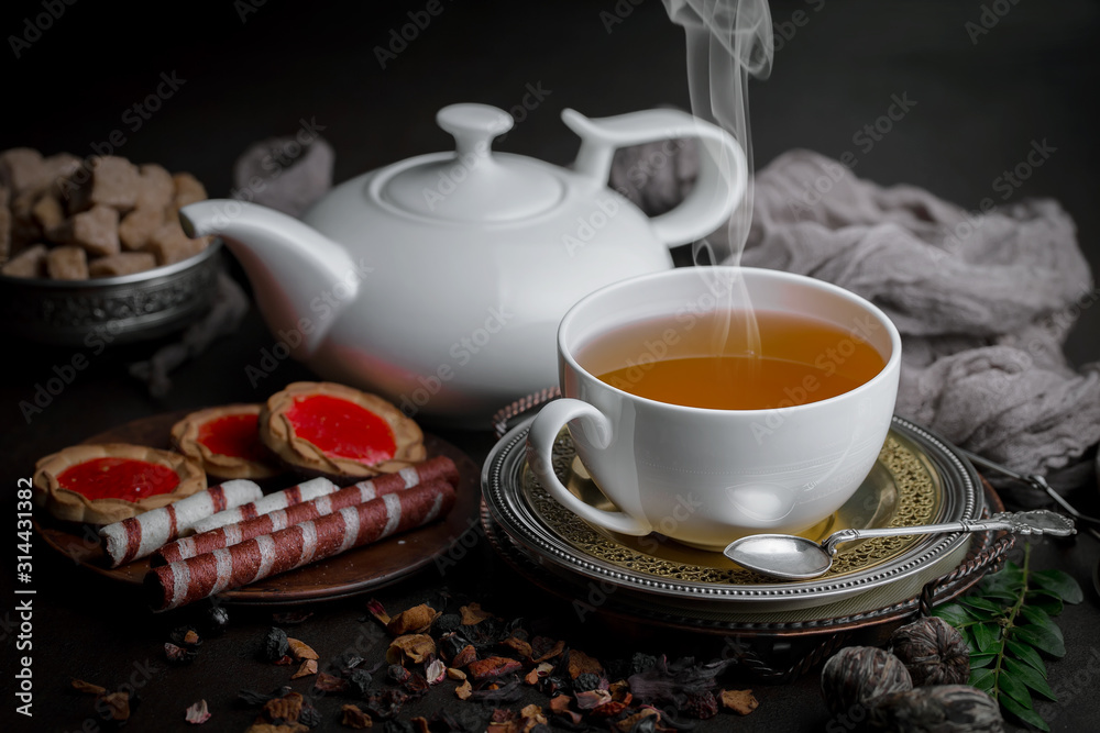 Tea hot drink on old background in composition on the table Tea hot drink on old background in composition on the table