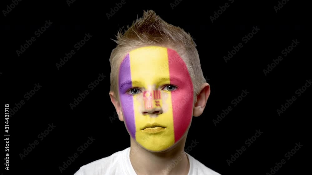 Sad fan of the football team of Andorra. A child with a face painted in national colors. Unhappy boy with sad eyes. Fiasco of your favorite team. Disappointment. Sadness. Experience. Failure. Bad luck Sad fan of the football team of Andorra. A child with a face painted in national colors. Unhappy boy with sad eyes. Fiasco of your favorite team. Disappointment. Sadness. Experience. Failure. Bad luck