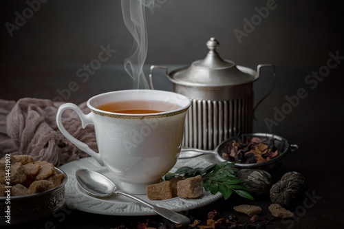 Tea hot drink on old background in composition on the table