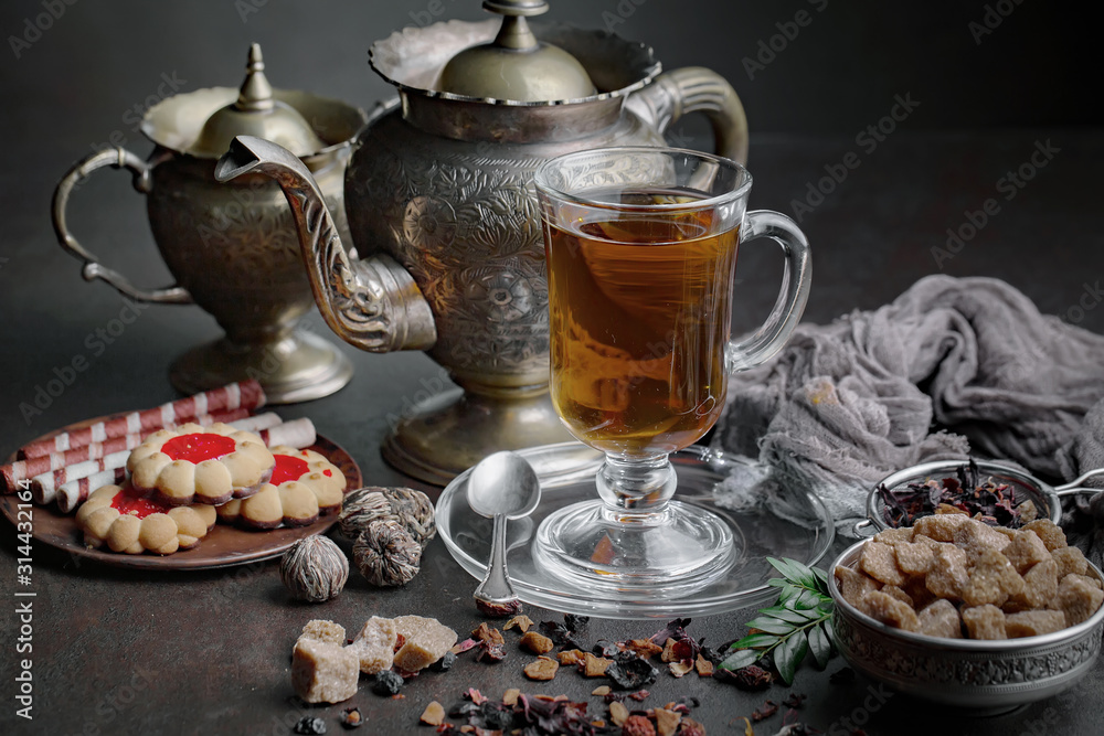 Tea hot drink on old background in composition on the table Tea hot drink on old background in composition on the table