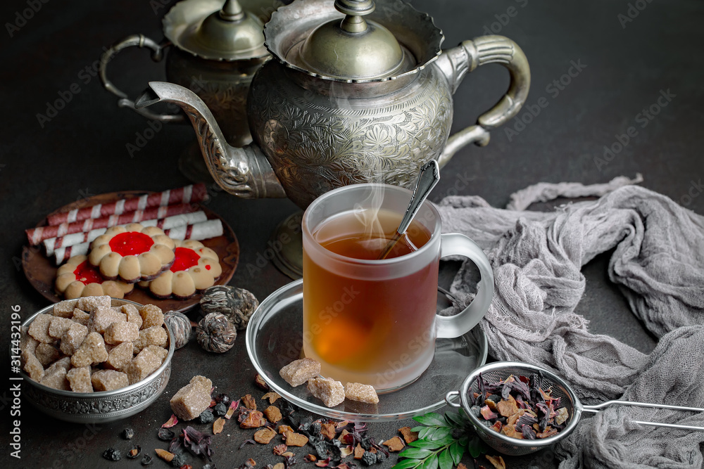 Tea hot drink on old background in composition on the table Tea hot drink on old background in composition on the table