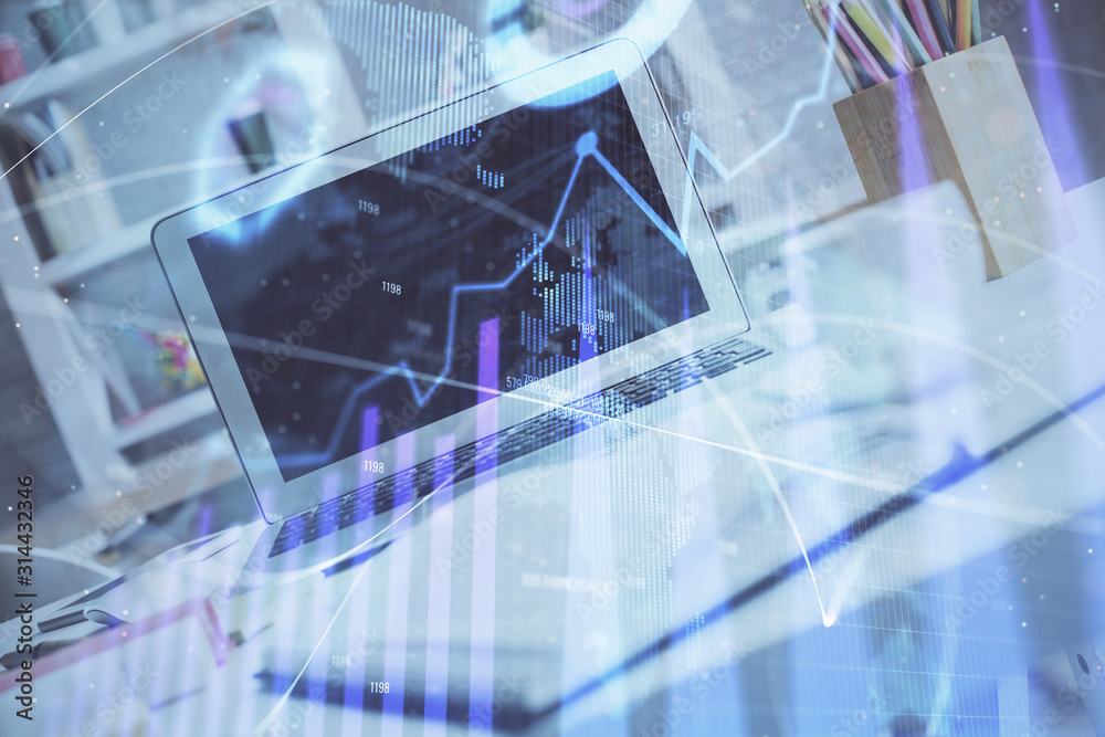 Forex Chart hologram on table with computer background. Double exposure. Concept of financial markets. Forex Chart hologram on table with computer background. Double exposure. Concept of financial markets.