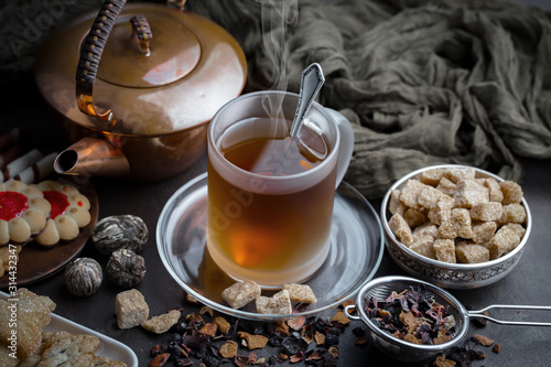 Tea hot drink on old background in composition on the table