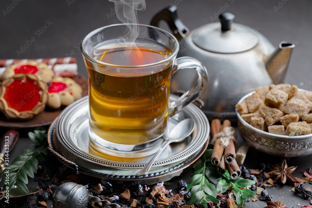 Tea hot drink on old background in composition on the table Tea hot drink on old background in composition on the table