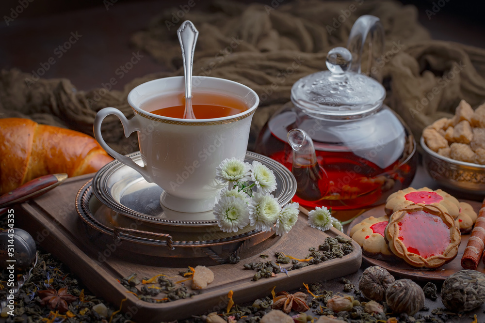 Tea hot drink on old background in composition on the table Tea hot drink on old background in composition on the table
