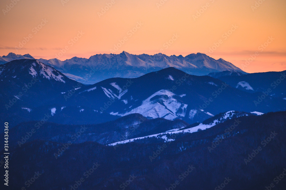 High Tatras panorama. Photo from Hill Krizna in slovakian mountains Velka Fatra. Sunrise light