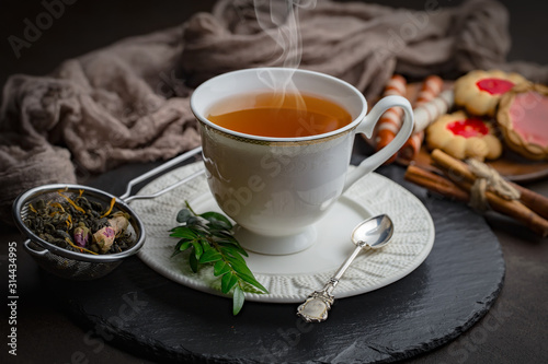 Tea hot drink on old background in composition on the table