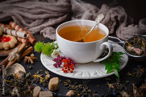 Tea hot drink on old background in composition on the table