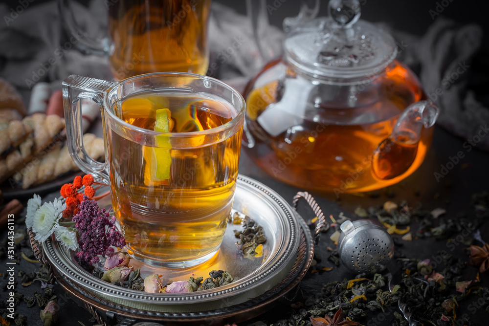 Tea hot drink on old background in composition on the table Tea hot drink on old background in composition on the table