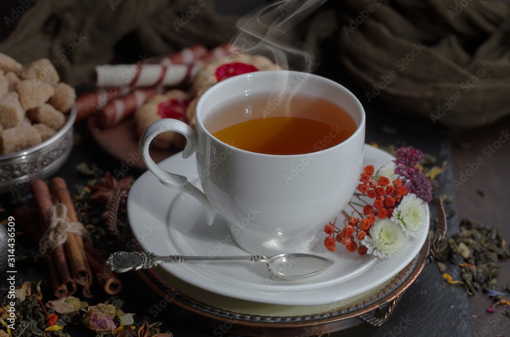 Tea in a cup on an old background Tea in a cup on an old background