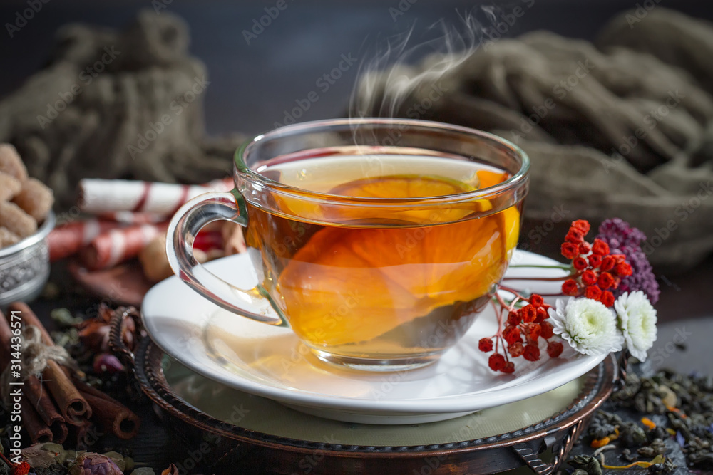Tea hot drink on old background in composition on the table Tea hot drink on old background in composition on the table