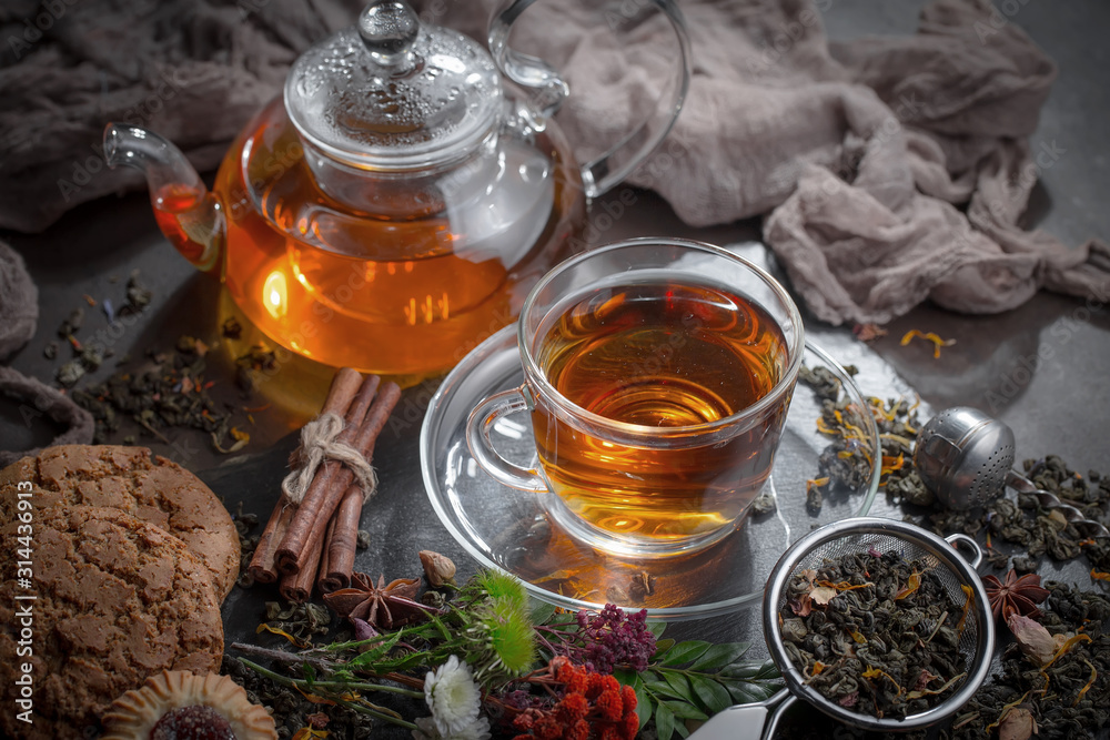 Tea hot drink on old background in composition on the table Tea hot drink on old background in composition on the table