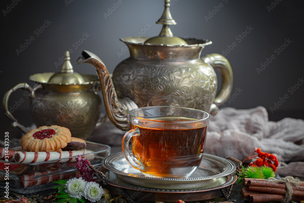 Tea hot drink on old background in composition on the table