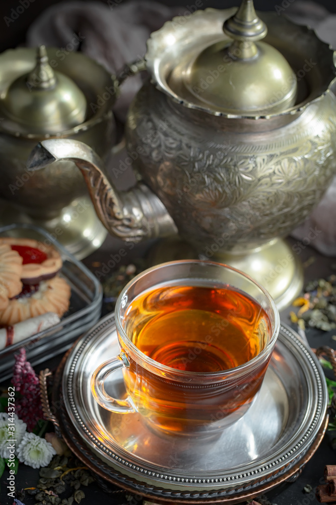 Tea in a cup on an old background Tea in a cup on an old background