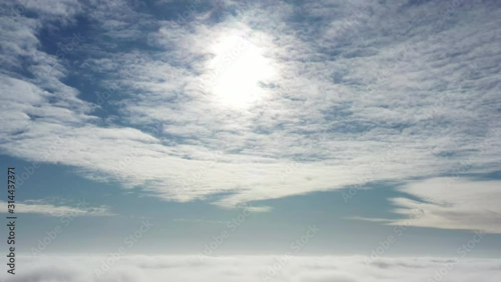 Immersion in the sky flying over the morning clouds, the camera slowly sinks into the fog Immersion in the sky flying over the morning clouds, the camera slowly sinks into the fog
