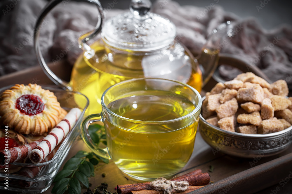 Tea hot drink on old background in composition on the table Tea hot drink on old background in composition on the table