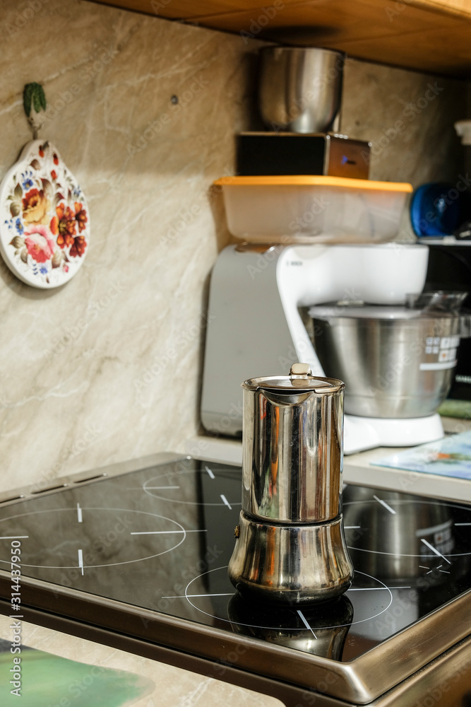 Moscow, Russia - December, 29, 2019: image of a geyser coffee maker standing on a stove Moscow, Russia - December, 29, 2019: image of a geyser coffee maker standing on a stove