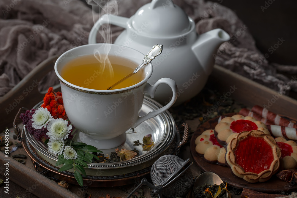 Tea hot drink on old background in composition on the table Tea hot drink on old background in composition on the table