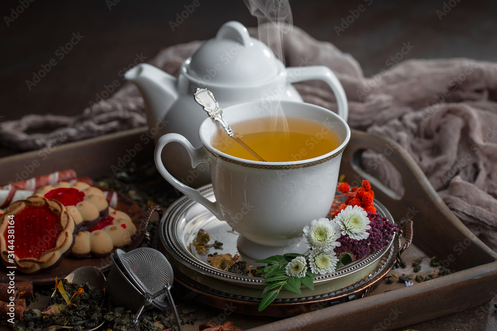 Tea hot drink on old background in composition on the table Tea hot drink on old background in composition on the table