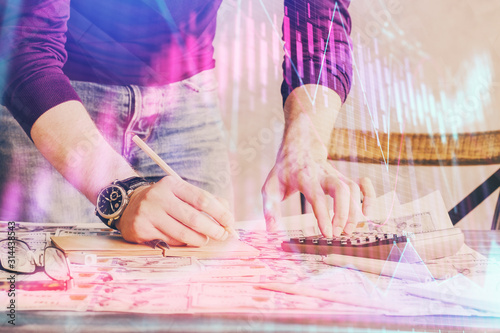 Multi exposure of man standing and planing investment with stock market forex chart.