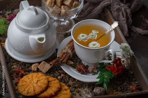 Tea hot drink on old background in composition on the table