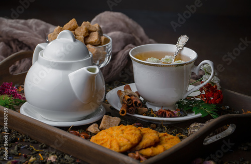 Tea hot drink on old background in composition on the table