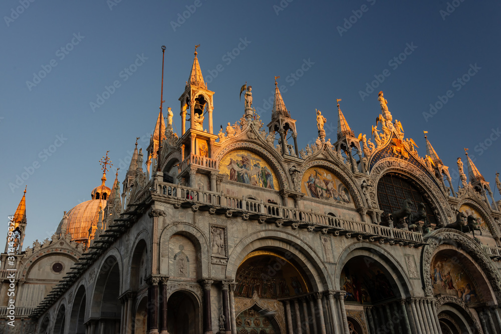 First sunbeams touch the spires of San Marco Basilica