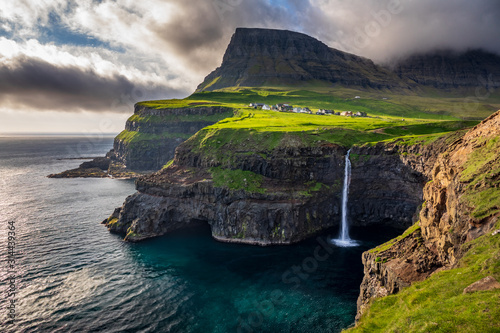 Gasadalur waterfall in Faroe Islands at dusk