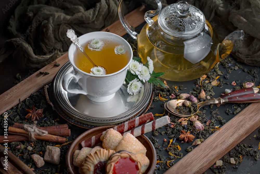 Tea hot drink on old background in composition on the table Tea hot drink on old background in composition on the table