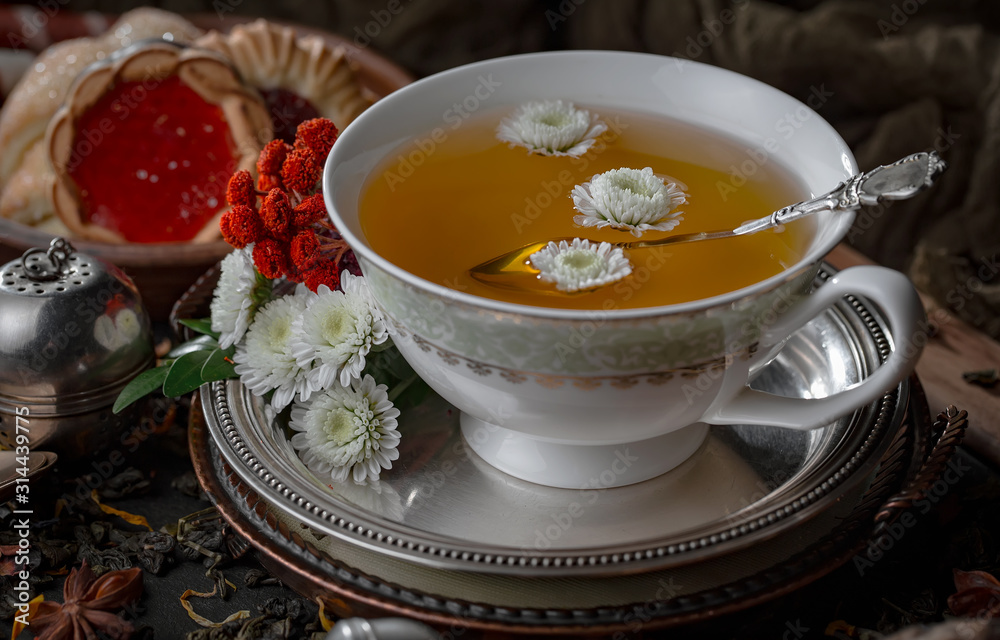 Tea in a cup on an old background Tea in a cup on an old background