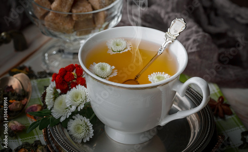 Tea hot drink on old background in composition on the table