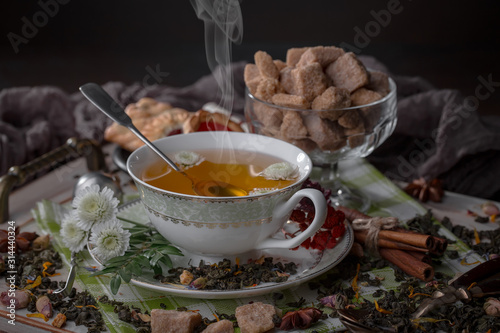 Tea hot drink on old background in composition on the table