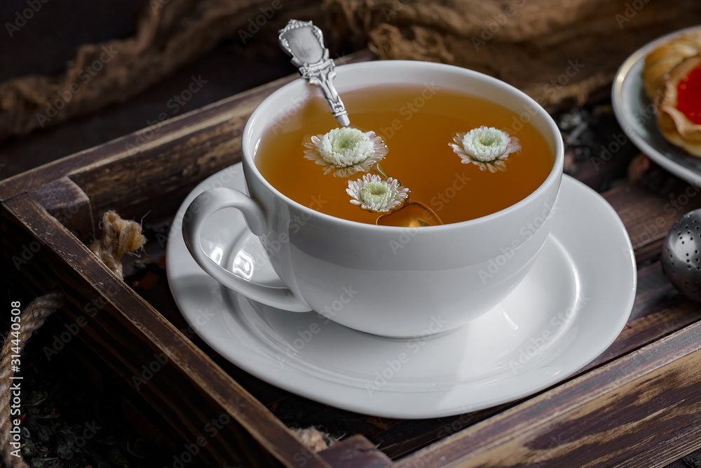 Tea hot drink on old background in composition on the table Tea hot drink on old background in composition on the table