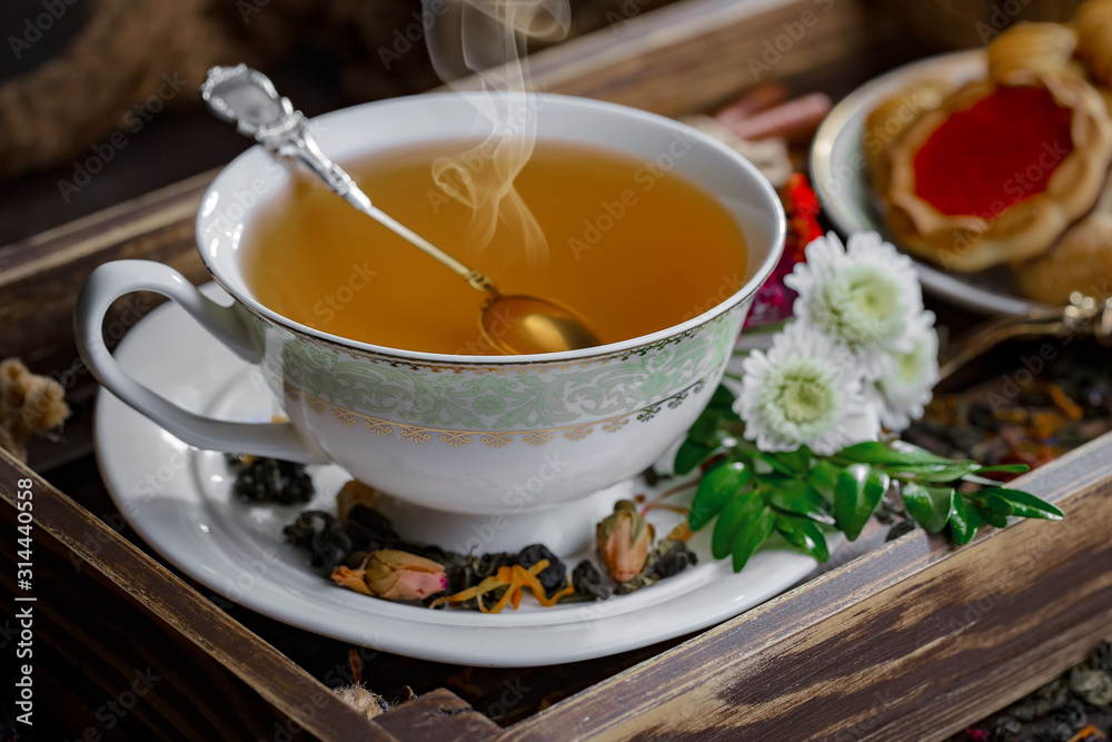 Tea hot drink on old background in composition on the table Tea hot drink on old background in composition on the table