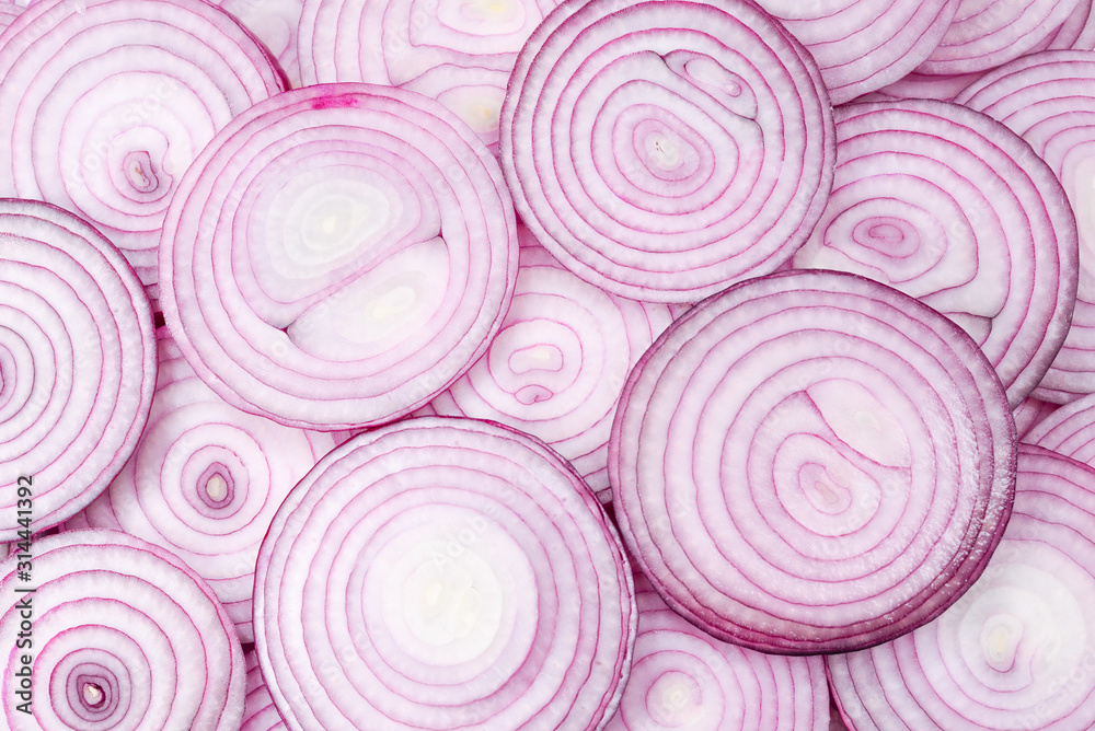 Onion slices as a background. Top view. Onion slices as a background. Top view.