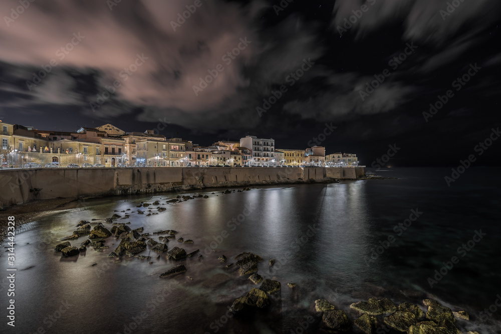 Syracuse Sicily. The seafront of Ortigia illuminated in the night