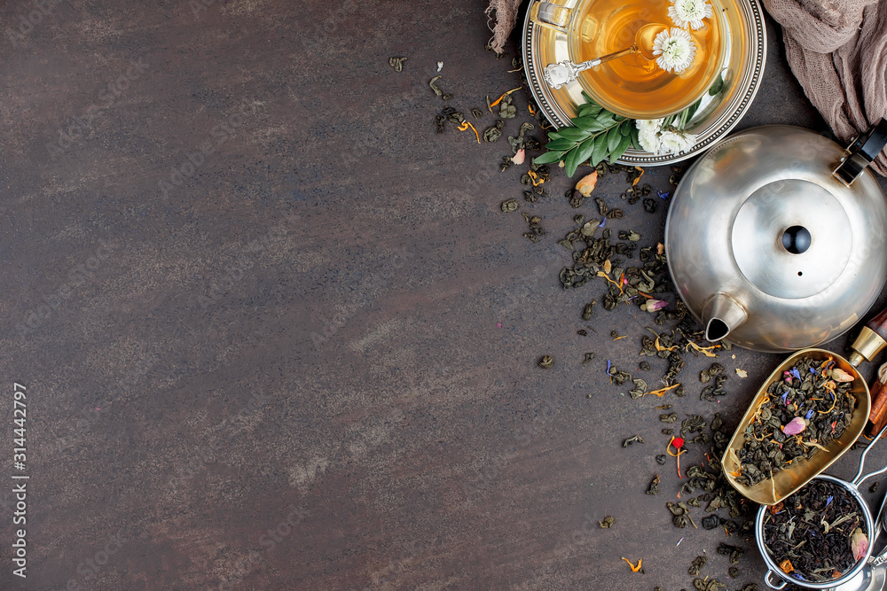 Fototapeta premium Tea hot drink on old background in composition on the table