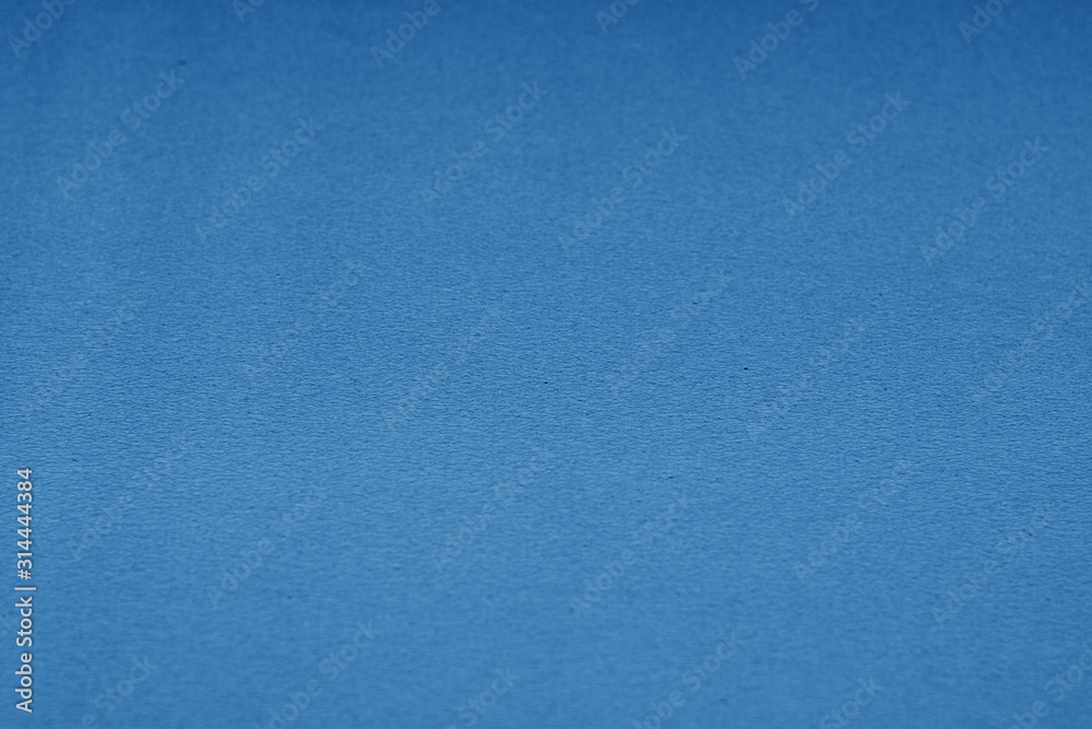 Plastic glittering texture with blur effect in navy blue tone. Plastic glittering texture with blur effect in navy blue tone.