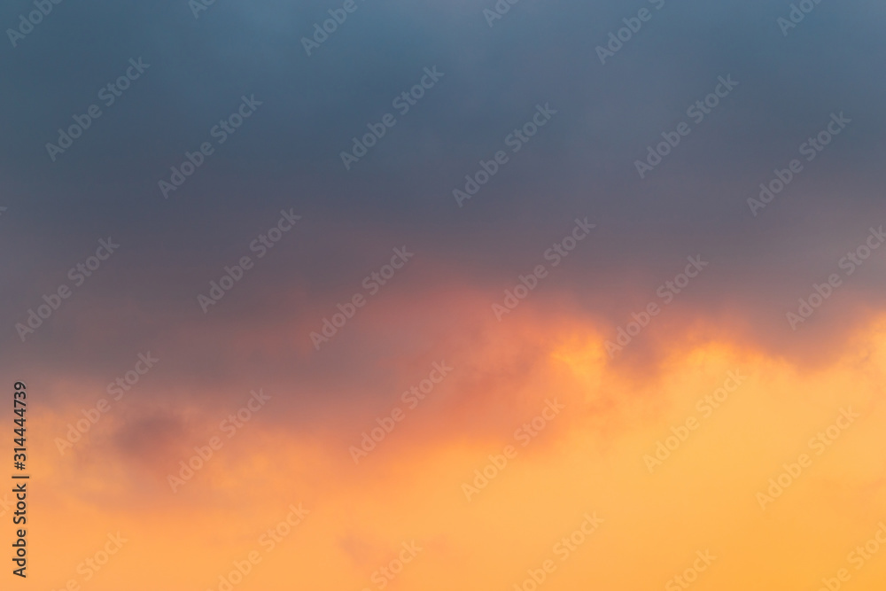 Grey cloud and orange sky.