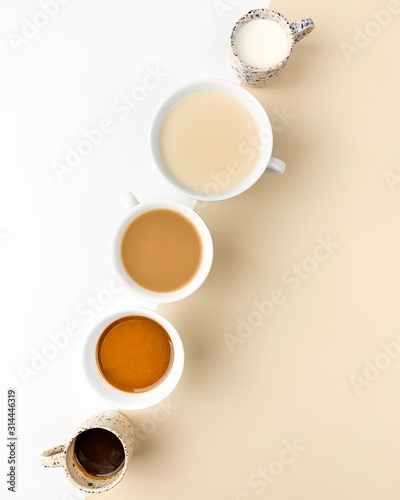Different coffee beverages on white beige bacground
