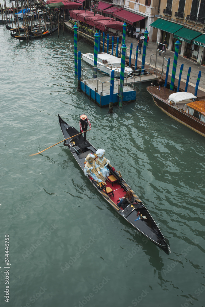 Venice, Italy - March 1, 2019: Gondola on a canal in the streets of Venice.
