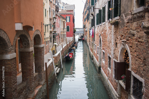 Venice, Italy - March 1, 2019: Gondolas on a canal in the streets of Venice.