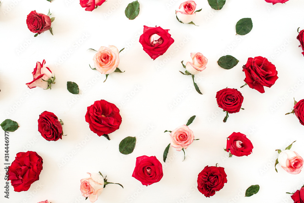 Round frame border of pink, red rose flower buds and leaves on white background. Mockup blank copy space. Flat lay, top view floral composition. Round frame border of pink, red rose flower buds and leaves on white background. Mockup blank copy space. Flat lay, top view floral composition.