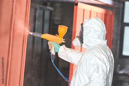 Canvas Print polymer coating of metal detail with powder spraying gun