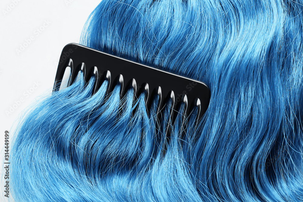 Obraz premium Top view of comb on colored blue hair isolated on white