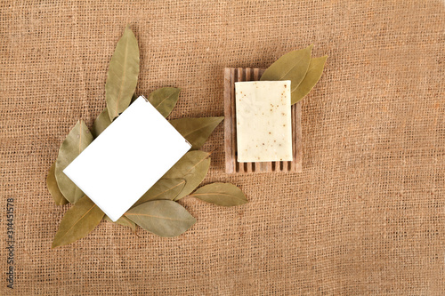 Olive soap and authentic stone on burlap