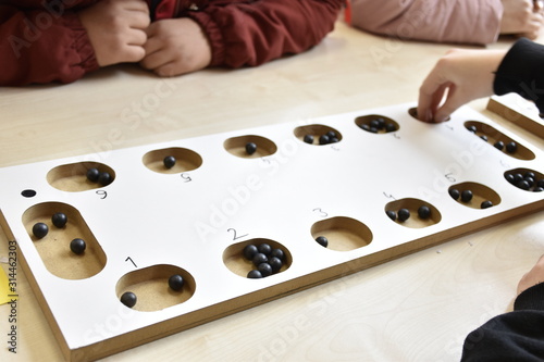 A table game of a beige color on a table: 