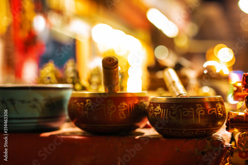 Traditional Tibetan singing bowls with sacred chants on them photo